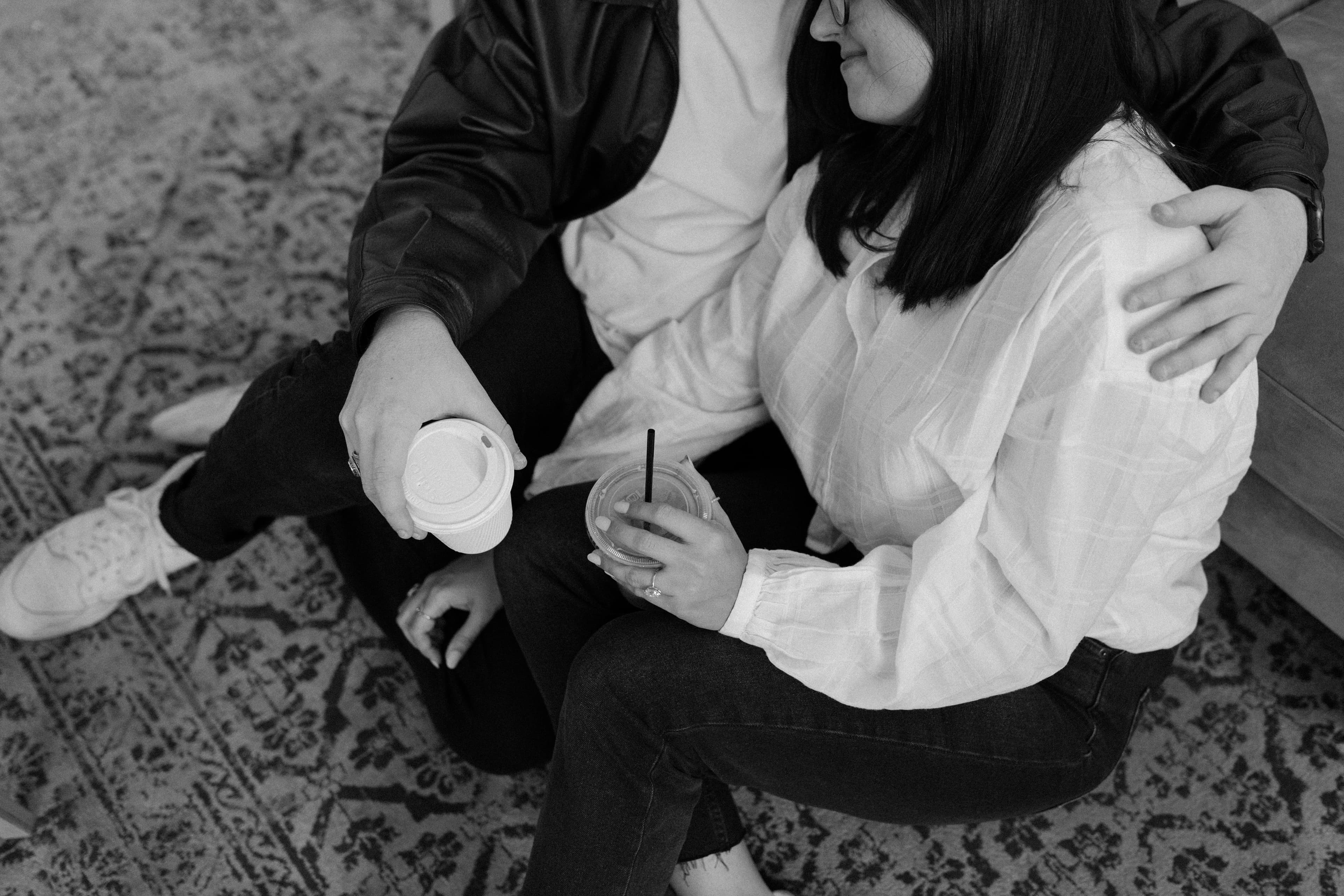 black & white photo of nick and brooke at a coffee shop